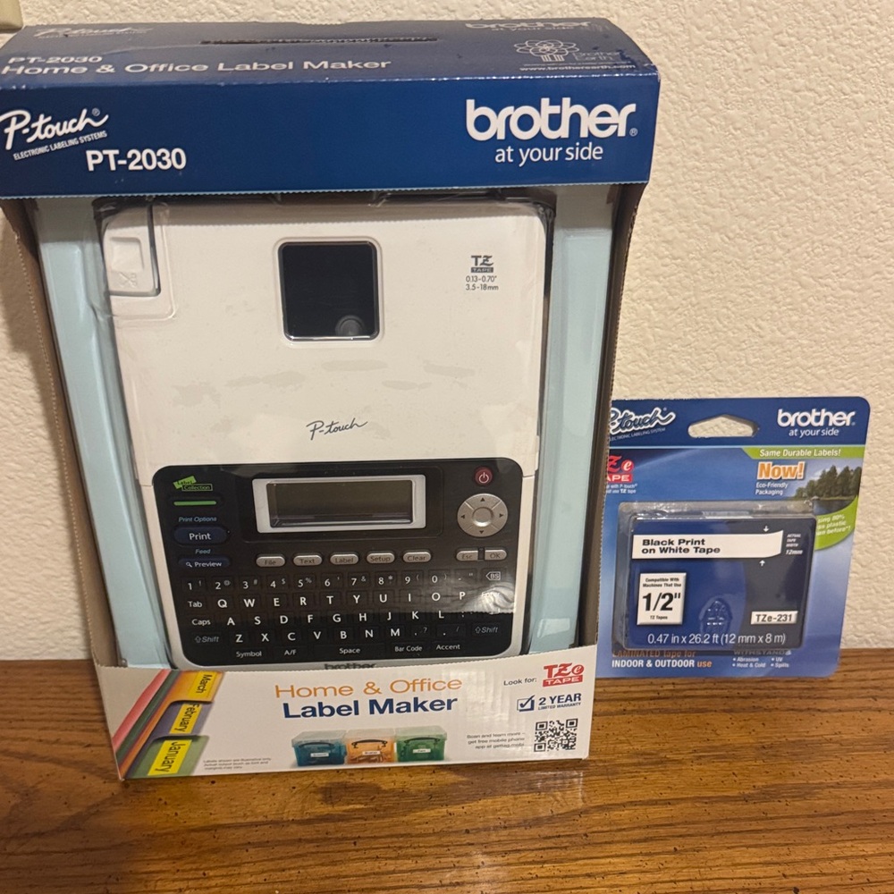 New Brother PT-2030 Label Maker with Black Print on White Tape
